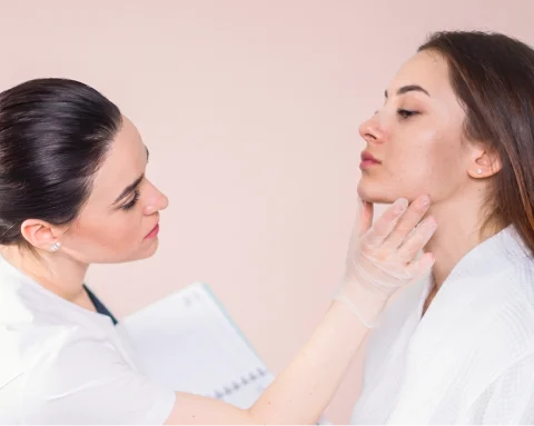 Patient seeing results post-surgery with medical support nearby