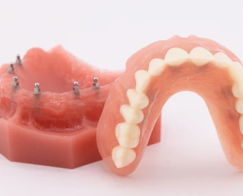 Smiling patient with restored confidence after procedure with dental implants