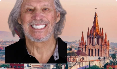 Gray-haired man smiling confidently after successful All-on-4 dental implant procedure
