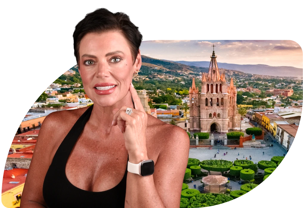 Elegant woman in San Miguel de Allende, smiling after receiving All on 4 dental implants, with a baroque church in the background.