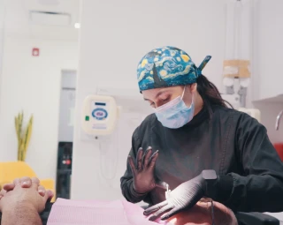 oral specialist fixing denture prosthesis in place