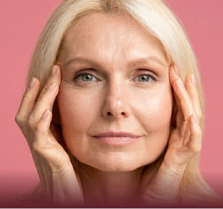 Woman with refined facial contours against neutral background