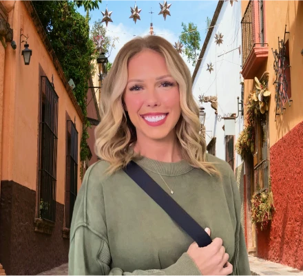 Joyful woman in her 30s with a brilliant, perfect Hollywood smile achieved through cosmetic dental veneers.