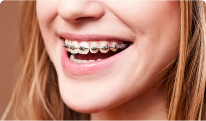 young patient with visible regular braces