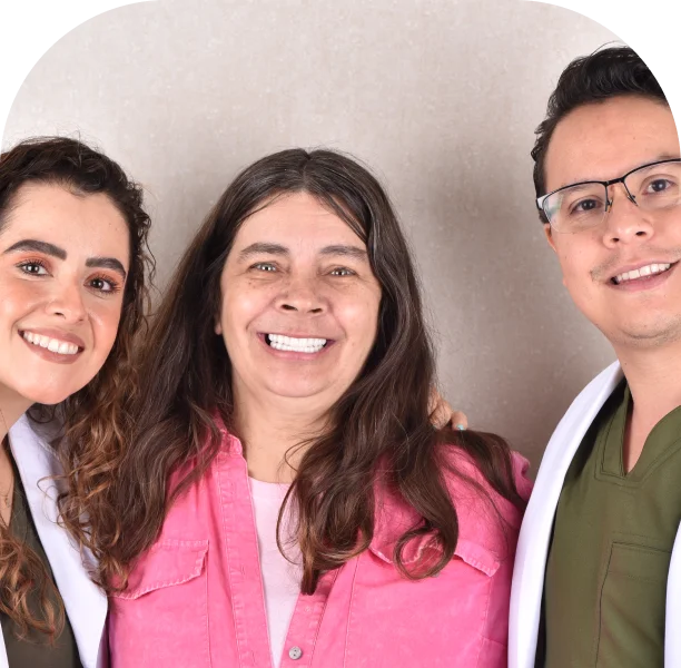Patients celebrating successful All on 4 dental implant treatment with the team at Forever Dental Clinic.