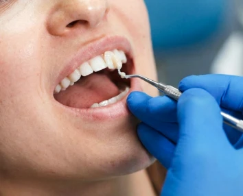 Smiling patient with restored confidence after procedure with dental implants