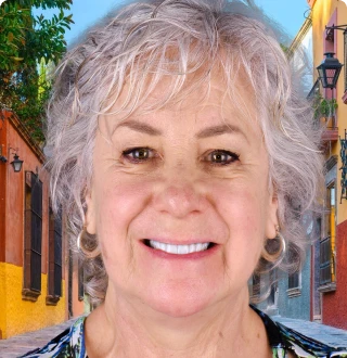 Smiling patient with restored confidence after procedure with dental implants