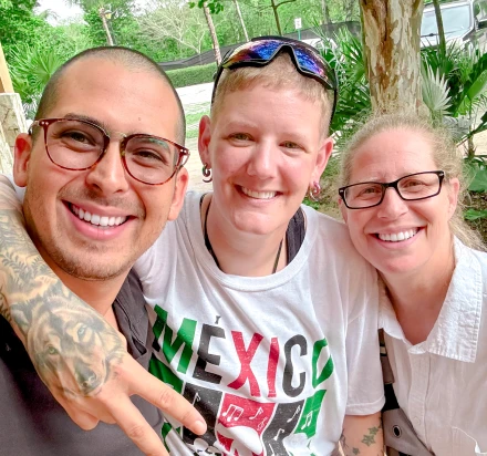 Happy family displaying their beautiful, perfect smiles achieved through cosmetic dentistry.